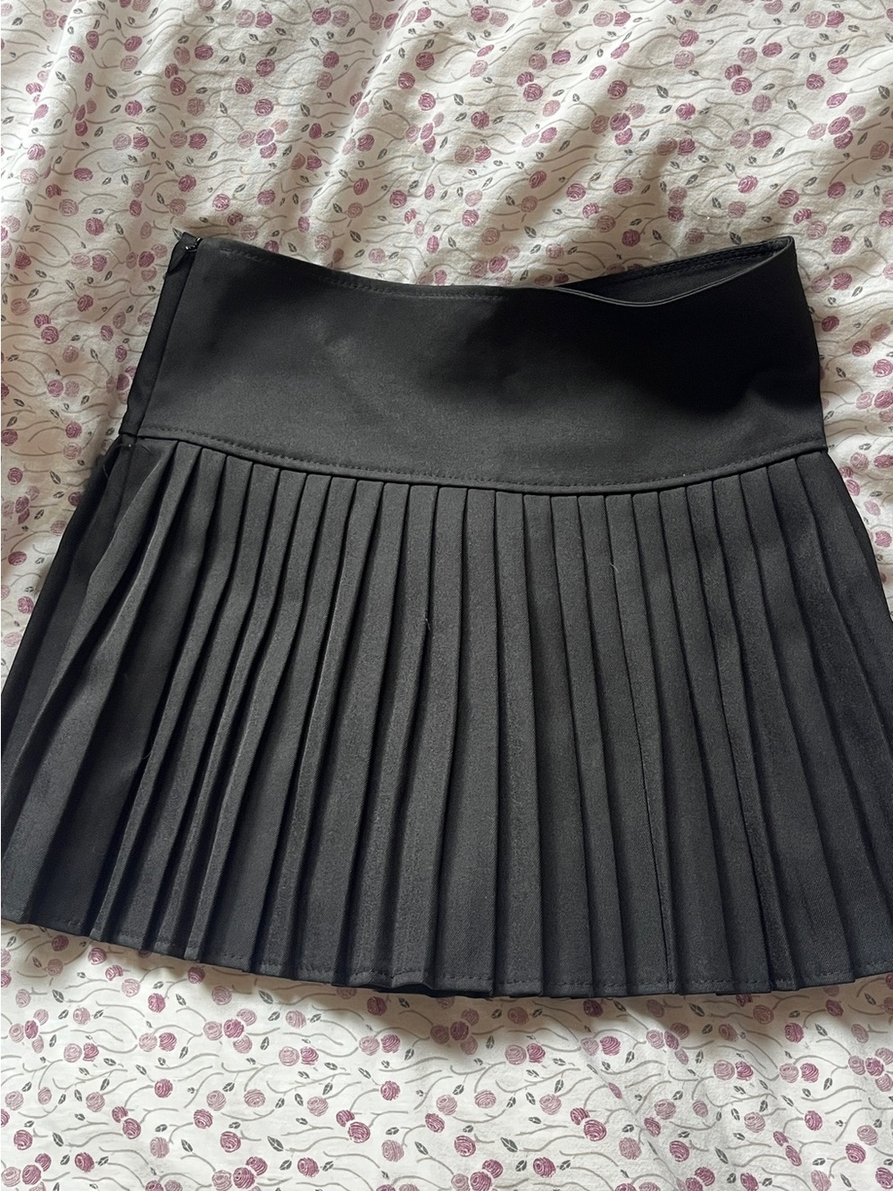 black pleated mini skirt